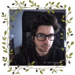 Vehbi, framed by leafy branches